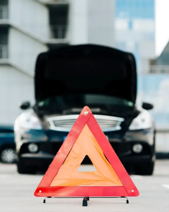 emergency-sign-with-black-car-background_23-2148257989